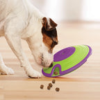 Jack Russell faisant tomber des croquettes du disque rotatif