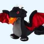 Dragon noir aux ailes rouges crachant une flamme orange