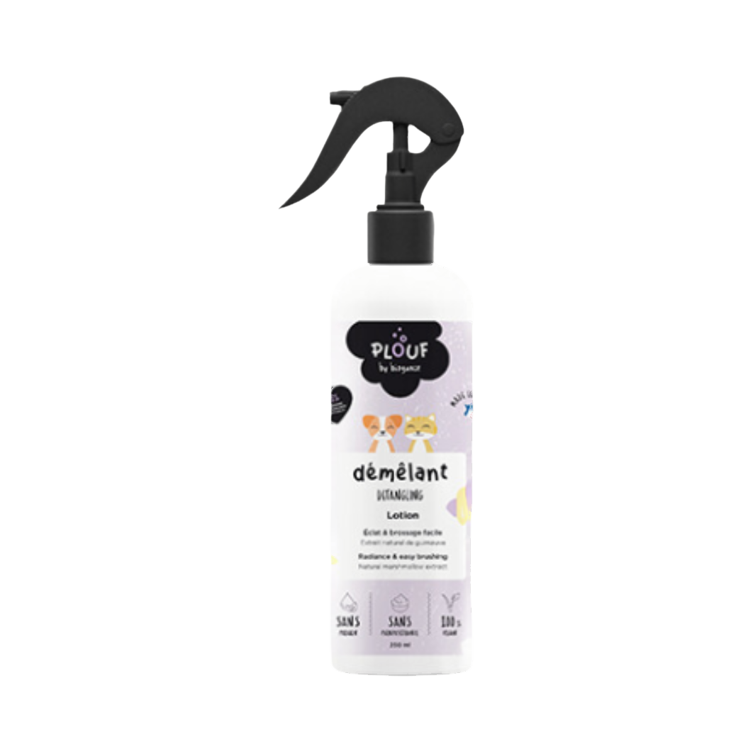 Flacon spray blanc à gâchette noire, étiquette crème à motifs