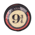Galette ronde marquée Platform 9 ¾ sur fond de brique