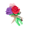 Trois roses rouge, violette et rose nouées d'un ruban beige