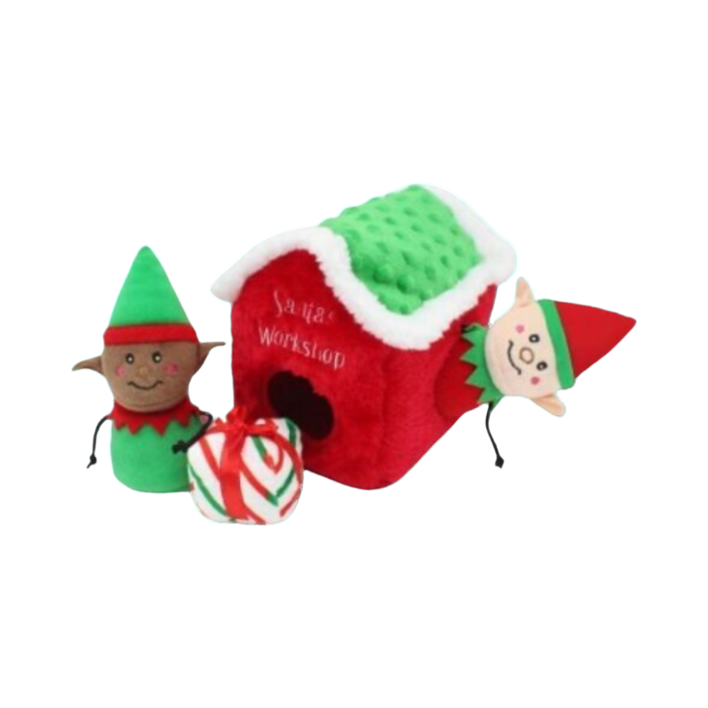 Lutin sortant de la maisonnette rouge à côté d'un cadeau rayé