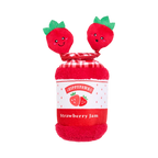 Pot couché ouvert avec deux fraises souriantes sorties