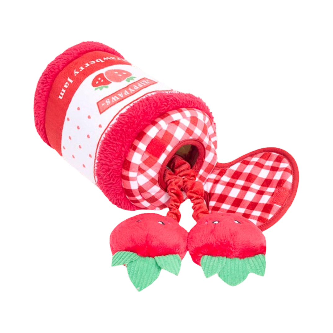 Deux fraises souriantes jaillissant du pot rouge