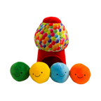 Distributeur rouge à pois multicolores et quatre boules souriantes