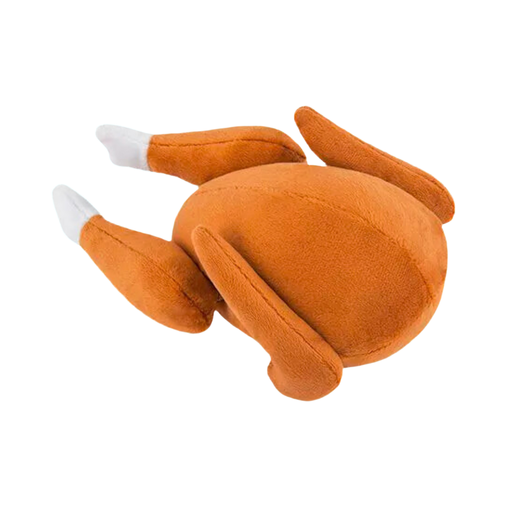 Volaille rôtie dorée en peluche aux pilons blancs, couchée