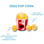 Seau pop corn et ses trois petites boules à cacher