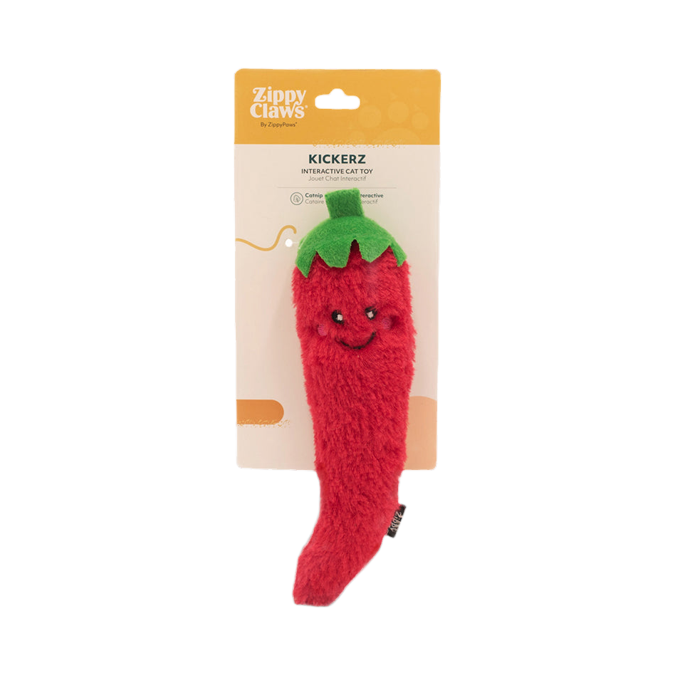 Piment rouge accroché à son carton d'emballage orange