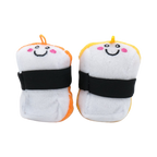 Deux sushis blancs à bande noire, face aux visages