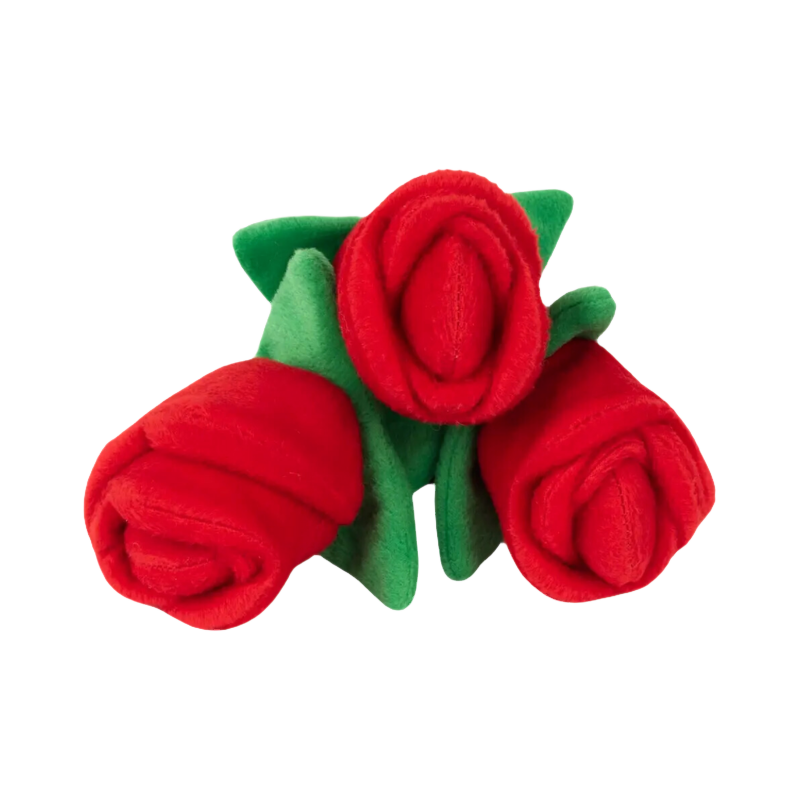 Trio de roses rouges aux feuilles vertes, vu de dessus