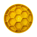 Assiette jaune à alvéoles hexagonales vue de dessus